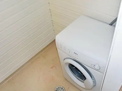 a washer and dryer in a corner of a room at 6 person holiday home in Aukra in Aukra