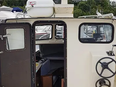 an open door of a boat with a boat at 6 person holiday home in Aukra in Aukra