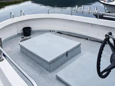 a boat with a box on the side of it at 6 person holiday home in Aukra in Aukra