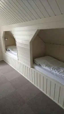 a bunk bed with two beds in a room at Lunde Turiststasjon in Skei