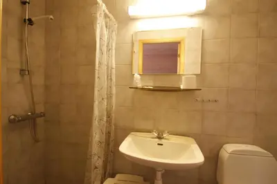 a bathroom with a sink and a toilet at Lunde Turiststasjon in Skei