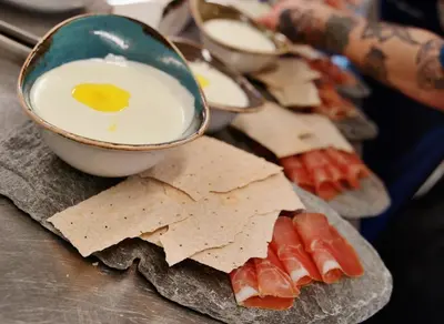 a plate of food with eggs and crackers on a table at Oset Fjellhotell in Gol
