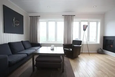 a living room with a couch and a table at Havsdalsgrenda Geilo Apartments in Geilo