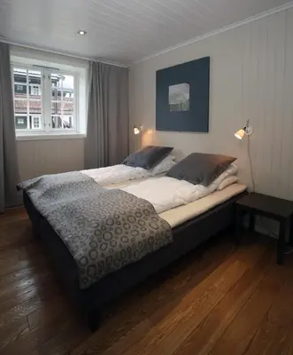 a bedroom with a large bed in a room at Havsdalsgrenda Geilo Apartments in Geilo