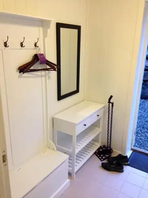 a bathroom with a white vanity and a mirror at Bakkevik Brygge in Kalvåg