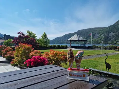 two figurines on a box on a picnic table with a gazebo at Bremanger Fjord Hotell in Svelgen