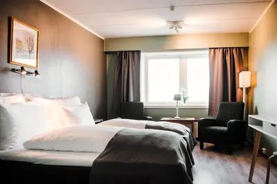 a hotel room with a bed and a window at Vågslidtun Hotel in Vågsli