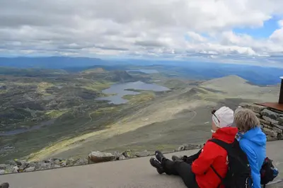 a couple of people sitting on top of a mountain at Sandviken Camping in Austbygdi
