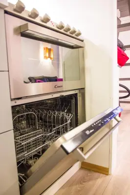 a kitchen with an oven with a dishwasher at Maristova apartment 109 in Filefjell