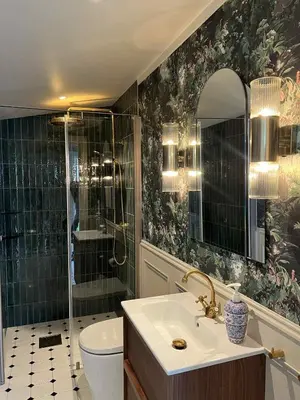 a bathroom with a shower and a sink and a toilet at Stryn - house by the river in Stryn