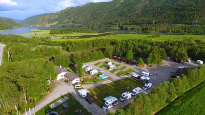 an aerial view of a parking lot next to a lake at Birkelund camping in Geilo
