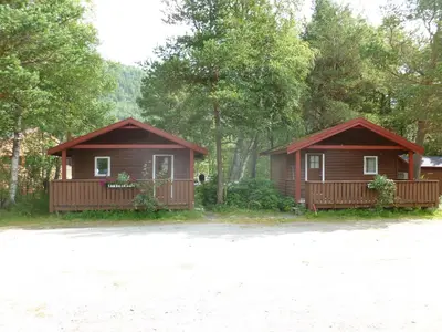 a couple of cottages in the woods at Birkelund camping in Geilo