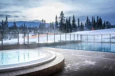 a swimming pool in the middle of a snow covered mountain at Skistar Lodge Trysil in Trysil