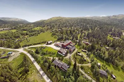 an aerial view of a house in the mountains at Rondane Høyfjellshotell in Mysusæter