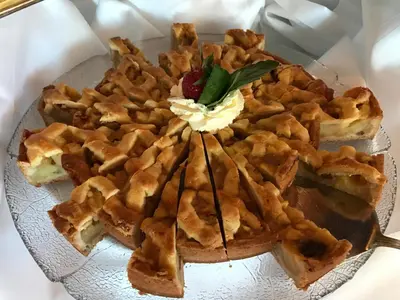 a plate of waffles with a raspberry on top at Alver Hotel in Alversund