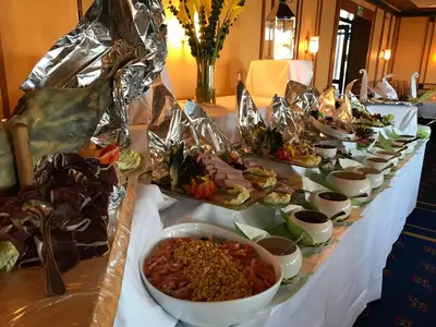 a table with many plates of food on it at Alver Hotel in Alversund