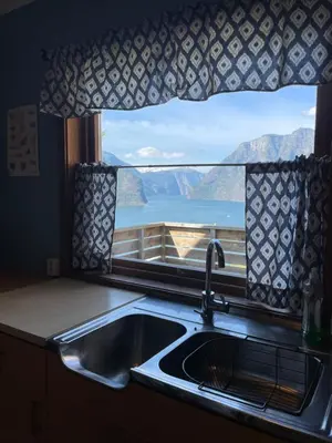 a kitchen sink with a view of a window at Kvam - Stegastein in Aurland
