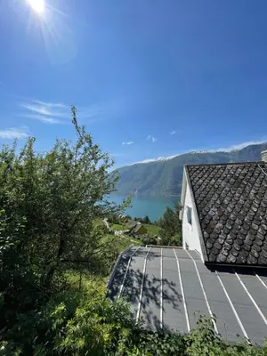 a view of a house with solar panels on the roof at Kvam - Stegastein in Aurland