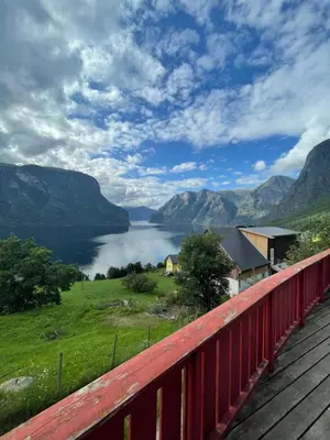 a balcony with a view of a lake and mountains at Kvam - Stegastein in Aurland