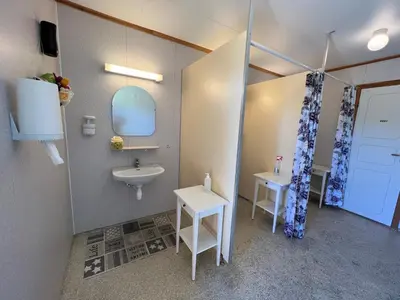 a bathroom with a sink and a mirror at Vistdal Camping in Myklebostad