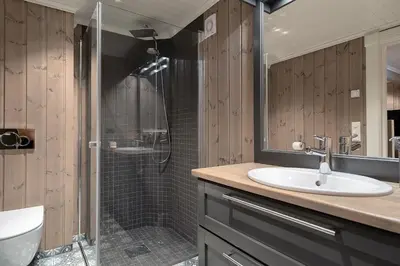 a bathroom with a sink and a shower at Tinden Grendehytte in Beitostøl
