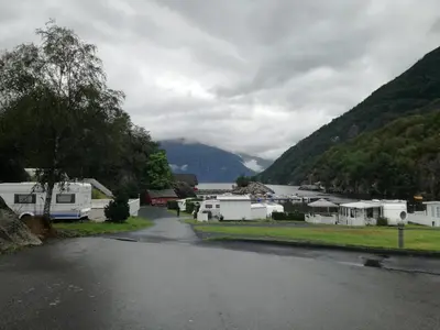 a view of a town with a lake and mountains at Kyrping Camping in Kyrping