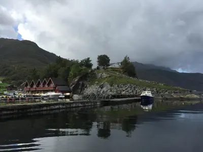 a boat is docked at a dock in the water at Kyrping Camping in Kyrping