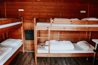 a room with three bunk beds in a cabin at Lyngmo Hytter in Hafslo