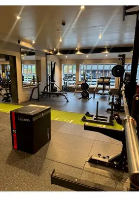 a gym with treadmills and machines in a room at Fanitullen Apartments in Hemsedal
