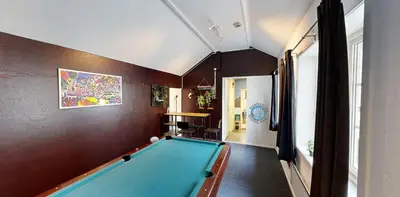 a hallway with a pool table in a room at Hardanger Hostel B&B in Lofthus