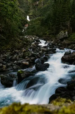 a stream of water rushing down a rocky river at Hardanger Hostel B&B in Lofthus