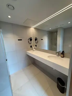 a bathroom with a sink and a mirror at Kinsarvik Camping in Kinsarvik