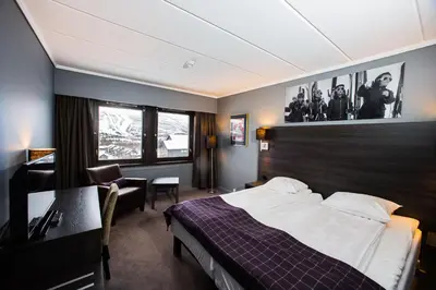 a hotel room with a bed and a desk at Geilo Hotel in Geilo