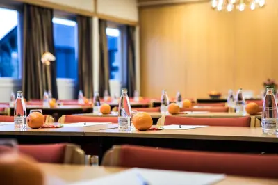 a room with tables and chairs with oranges on them at Geilo Hotel in Geilo