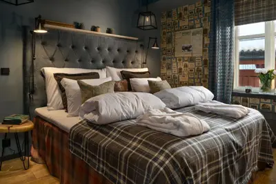 a bed with two pillows on it in a bedroom at Knutholmen in Kalvåg