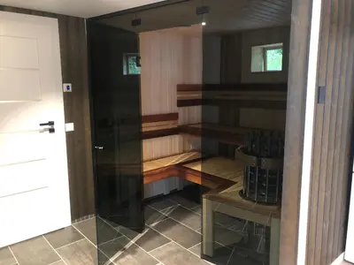 a glass door to a wine cellar in a house at Jolster sauna apartments in Skei