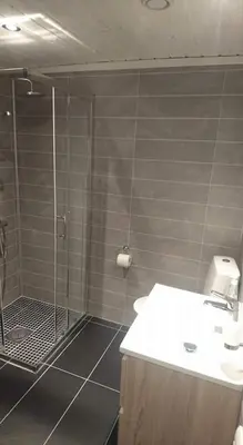 a bathroom with a shower and a sink at Skei Apartments in Svingvoll