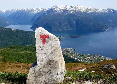 a rock with a red cross on it on a mountain at Villa Holmen 2 in Balestrand