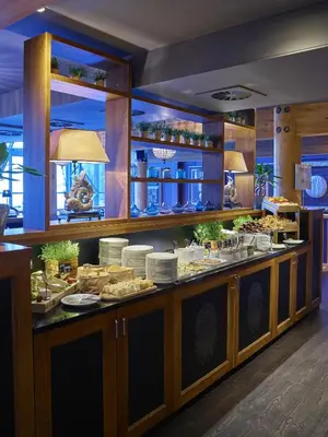 a buffet line in a restaurant with food at Fretheim Hotel in Flåm