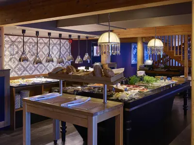 a buffet line with food on display in a restaurant at Fretheim Hotel in Flåm