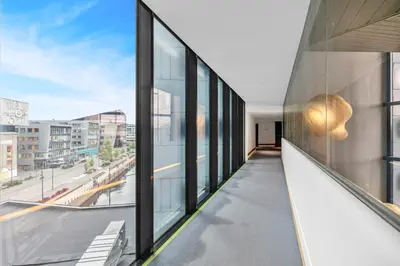 an office building with large windows and a view of a street at Clarion Hotel Trondheim in Trondheim