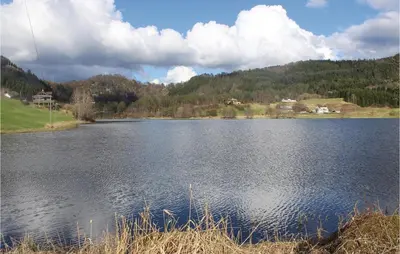 a large body of water with mountains in the background at 5 Bedroom Lovely Home In Seim in Seim