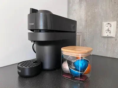 a coffee maker sitting on a counter next to a cup at Blue House Odda in Odda