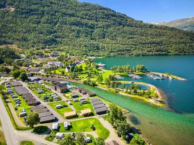 an aerial view of a resort next to a lake at Mikkelparken Ferietun in Kinsarvik