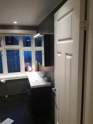 a bathroom with a sink and a window at Presterudveien 125 in Vikersund