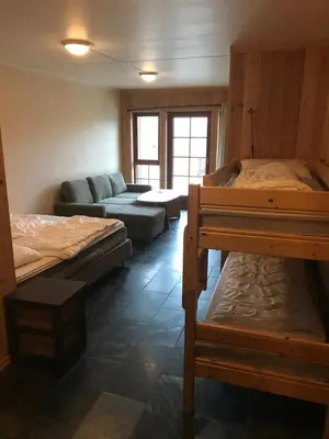 a living room with two beds and a couch at Haukelifjell Skisenter in Vågsli