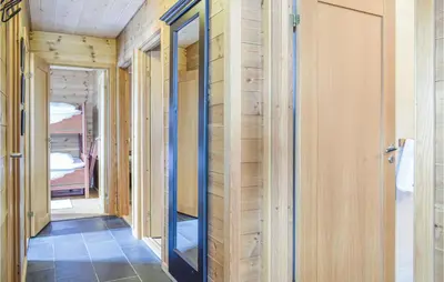 a hallway of a house under construction with wooden walls at Four-Bedroom Holiday Home In Roldal in Røldal
