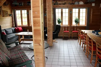 a living room with a couch and a table at Røldalstunet Overnatting in Røldal