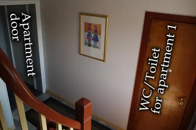 a stairway with a picture on the wall and a stair case at Apartment in Herand, Hardanger in Herand