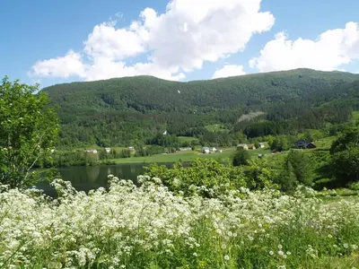 a view of a lake with mountains in the background at 5 bedrooms, large apartment with nice view and nature in Herand